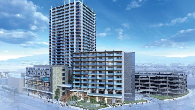 高層タワーと中層棟が一体となった複合施設の完成予想図